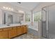 Bright bathroom featuring a double vanity, soaking tub, and separate shower at 3517 Boren Ct, Raleigh, NC 27616