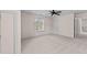 Carpeted bedroom with a ceiling fan and a window at 3517 Boren Ct, Raleigh, NC 27616