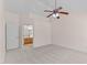 Spacious bedroom with neutral carpet and a ceiling fan, next to the bathroom at 3517 Boren Ct, Raleigh, NC 27616