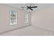 Bedroom with a ceiling fan and natural light from two windows at 3517 Boren Ct, Raleigh, NC 27616