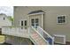 A cozy wooden deck with a white railing and stairs offers an excellent outdoor spot at 3517 Boren Ct, Raleigh, NC 27616