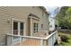 A view of a wooden deck with white railings and stairs at 3517 Boren Ct, Raleigh, NC 27616