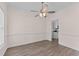 Open-concept dining area with wood-look flooring and neutral color palette at 3517 Boren Ct, Raleigh, NC 27616