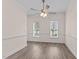 Bright dining room with wood-look floors and a modern ceiling fan at 3517 Boren Ct, Raleigh, NC 27616
