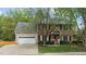 Charming brick two-story home with a well-maintained lawn and attached garage at 3517 Boren Ct, Raleigh, NC 27616