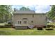 A view of a home exterior and well-maintained backyard with a white deck at 3517 Boren Ct, Raleigh, NC 27616