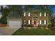 Charming two-story brick home with a well-manicured lawn, red front door, and attached two-car garage at 3517 Boren Ct, Raleigh, NC 27616