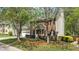 Charming two-story brick home with a well-manicured lawn, red front door, and attached two-car garage at 3517 Boren Ct, Raleigh, NC 27616