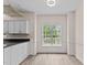 Kitchen view features stylish cabinetry and an eat-in dining area with natural light at 3517 Boren Ct, Raleigh, NC 27616