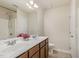 A bathroom featuring a double sink vanity, a full shower, and a toilet at 360 Callandale Ln, Durham, NC 27703