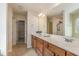 This bathroom features double sinks, a large mirror, and a tiled shower at 360 Callandale Ln, Durham, NC 27703
