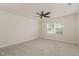 A spacious carpeted bedroom features a ceiling fan and a large window at 360 Callandale Ln, Durham, NC 27703