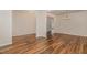 Open-concept dining room with hardwood floors and modern chandelier lighting at 360 Callandale Ln, Durham, NC 27703