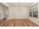 Elegant dining room with hardwood floors, chandelier, and lots of natural light at 360 Callandale Ln, Durham, NC 27703