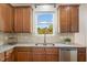 This kitchen features granite countertops, stainless steel appliances, and tile backsplash at 360 Callandale Ln, Durham, NC 27703