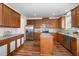 Kitchen featuring granite countertops, stainless steel appliances, and wood cabinets at 360 Callandale Ln, Durham, NC 27703