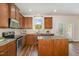 This kitchen features an island, stainless steel appliances, recessed lighting, and hardwood floors at 360 Callandale Ln, Durham, NC 27703