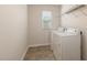 This laundry room features a washer, dryer, and white walls at 360 Callandale Ln, Durham, NC 27703