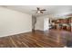 Open living room with wood floors that connects to the kitchen at 360 Callandale Ln, Durham, NC 27703