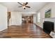 Spacious living room with wood flooring, fireplace, and open floor plan at 360 Callandale Ln, Durham, NC 27703