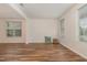 Bright and airy living room with beautiful hardwood floors and neutral paint at 360 Callandale Ln, Durham, NC 27703