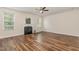 Bright living room with wood flooring, fireplace, and ceiling fan at 360 Callandale Ln, Durham, NC 27703