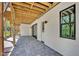Covered back patio featuring stone pavers and access to the backyard at 3832 Noremac Dr, Raleigh, NC 27612
