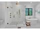 Bathroom showcasing the glass enclosed shower, soaking tub, and gold fixtures at 3832 Noremac Dr, Raleigh, NC 27612