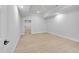 Bedroom features hardwood floors, recessed lights, and a doorway leading to another room at 3832 Noremac Dr, Raleigh, NC 27612