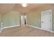 This bedroom features a window and white door and hardwood floors at 3832 Noremac Dr, Raleigh, NC 27612