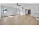 Bright, spacious bedroom featuring hardwood floors, a ceiling fan, and natural light from windows, creating a comfortable and inviting space at 3832 Noremac Dr, Raleigh, NC 27612