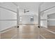 Spacious bedroom with light wood floors, ceiling fan and white walls at 3832 Noremac Dr, Raleigh, NC 27612