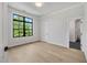 Bedroom featuring hardwood floors and large window views, offering a comfortable and airy space at 3832 Noremac Dr, Raleigh, NC 27612