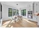 Bright dining room features large windows and hardwood floors and stainless double ovens at 3832 Noremac Dr, Raleigh, NC 27612