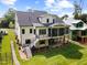 Aerial view of two-story home with deck, screened in porch, lush lawn, and well-kept landscaping at 3832 Noremac Dr, Raleigh, NC 27612