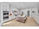 Bright, modern kitchen with a large island, white cabinets, and stainless steel appliances at 3832 Noremac Dr, Raleigh, NC 27612