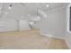 Bright and airy living room with modern light fixture and large windows providing ample natural light at 3832 Noremac Dr, Raleigh, NC 27612