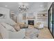 Open living room showcasing a fireplace, built-in shelving, and comfortable seating at 3832 Noremac Dr, Raleigh, NC 27612