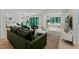 Inviting living room with stylish furniture, modern decor, and a view into an adjacent dining space at 3832 Noremac Dr, Raleigh, NC 27612