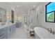 Spacious main bathroom features double vanity, soaking tub, and glass-enclosed shower at 3832 Noremac Dr, Raleigh, NC 27612