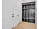 Bright mudroom features custom cubbies, providing ample storage and organization space, with a door that leads outside at 3832 Noremac Dr, Raleigh, NC 27612