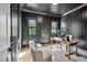 Office featuring paneled walls, natural light, modern lighting, and neutral color palette at 3832 Noremac Dr, Raleigh, NC 27612