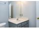Bathroom with painted blue walls, mirror, vanity, and updated fixtures at 3900 Inkberry Ct, Apex, NC 27539