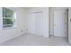 Bright bedroom with carpeted floor, closet, and an entrance door at 3900 Inkberry Ct, Apex, NC 27539