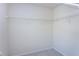 Empty walk-in closet with carpeted floor and white wire shelving at 3900 Inkberry Ct, Apex, NC 27539