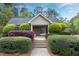Charming community clubhouse featuring a brick facade, manicured landscaping, and a welcoming entrance for residents at 3900 Inkberry Ct, Apex, NC 27539