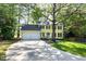 Charming two-story home with a two-car garage and landscaped front yard with mature tree at 3900 Inkberry Ct, Apex, NC 27539