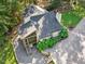 Bird's eye view showcases home's roof, landscaping, screened-in patio and gravel lot at 3900 Maplefield Dr, Raleigh, NC 27613