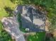 An aerial view of a house with gray roof surrounded by lush trees and greenery at 3900 Maplefield Dr, Raleigh, NC 27613