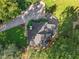 An aerial view of the property, highlighting the lush landscaping and driveway at 3900 Maplefield Dr, Raleigh, NC 27613
